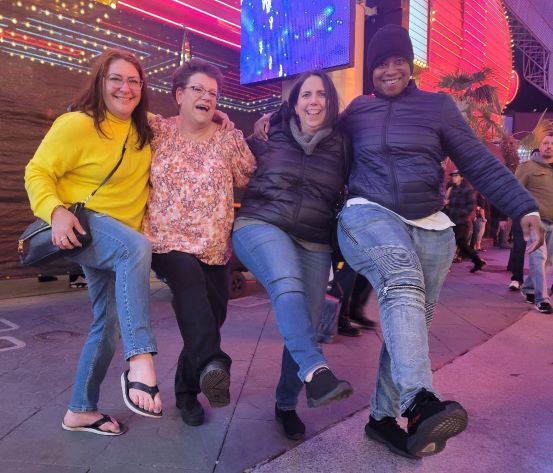 Four women do the can-can outdoors in Las Vegas.